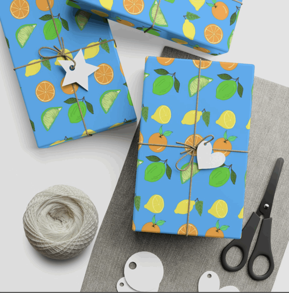Square gifts wrapped in citrus fruit wrapping paper and tied with string